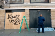 An employee of Make School, a computer science college, paints the plywood that covers its  windows to discourage looting in San Francisco on March 31, 2020 .
Millions of San Francisco Bay Area  residents were ordered to stay home for the third week to slow the spread of the coronavirus as part of a lockdown effort.