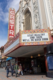 Pedestrians walk past the Castro Theater on Castro Street in San Francisco, California, U.S., on  March 18, 2020.
Millions of San Francisco Bay Area  residents were ordered to stay home to slow the spread of the coronavirus as part of a lockdown effort, marking one of the nation's strongest efforts to stem the spread of the deadly virus.