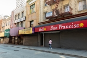 A woman wearing a mask walks inside Chinatown in San Francisco on March 20, 2020. The entire neighborhood is empty of tourists and has all its stores closed.
California residents were ordered to stay home to slow the spread of the coronavirus as part of a lockdown effort.