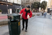 Raven Anderson, a member of a local business association disinfects a street garbage with alcohol in downtown San Francisco on March 20, 2020. 
California residents were ordered to stay home to slow the spread of the coronavirus as part of a lockdown effort.