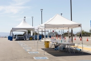 Health care workers assist people at a COVID-19 testing drive-through center in Hayward, CA, on April 15, 2020.  
Hayward firefighters with cooperation with Hayward Police and paramedics set up the center to take pressure off hospital emergency rooms. It is free and available to anyone who show symptoms such as fever.