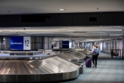 A traveler walks through the baggage claim section that sits empty of travelers at the San Francisco International airport on April 7, 2019.
The COVID-19 pandemic has reduced air traffic tremendously.