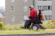 A handicapped man wearing a mask on one of the streets of San Francisco on April 8, 2020. Elderly people with health conditions are the most affected by the COVID-19 pandemic.