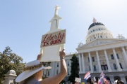 A protester in front of the California State Capitol in Sacramento, CA, on May 1, 2020.