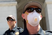 A police officer wearing a mask  blocks the access to the California State Capitol in Sacramento, CA, on May 1, 2020.