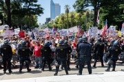 Police officers prevent protesters from entering the California State Capitol in Sacramento, CA, on May 1, 2020.