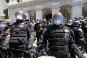 Police officers block the access to the California State Capitol in Sacramento, CA, on May 1, 2020.