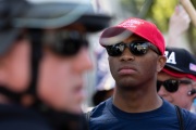 Police officers prevent protesters from entering the California State Capitol in Sacramento, CA, on May 1, 2020.