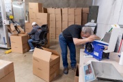 A visually impaired worker with his blind colleague behind at  the production line of toilet paper packets at the Sirkin Center in San Leandro, CA, on May 11, 2020.