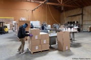 A blind worker arranges boxes at the production line of cleaning products at the Sirkin Center in San Leandro, CA, on May 11, 2020.