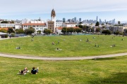 People lay on the grass inside circles drawn to encourage  social distancing at Dolores Park in San Francisco, CA, on  May 21, 2020. This effort marks the city’s latest effort to get back to some sort of normalcy following the long shelter-in-place order while trying to keep the risks of infection from the coronavirus to the minimum.