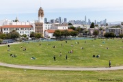People lay on the grass inside circles drawn to encourage  social distancing at Dolores Park in San Francisco, CA, on  May 21, 2020. This effort marks the city’s latest effort to get back to some sort of normalcy following the long shelter-in-place order while trying to keep the risks of infection from the coronavirus to the minimum.