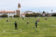 People lay on the grass inside circles drawn to encourage  social distancing at Dolores Park in San Francisco, CA, on  May 21, 2020. This effort marks the city’s latest effort to get back to some sort of normalcy following the long shelter-in-place order while trying to keep the risks of infection from the coronavirus to the minimum.