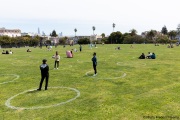 People lay on the grass inside circles drawn to encourage  social distancing at Dolores Park in San Francisco, CA, on  May 21, 2020. This effort marks the city’s latest effort to get back to some sort of normalcy following the long shelter-in-place order while trying to keep the risks of infection from the coronavirus to the minimum.