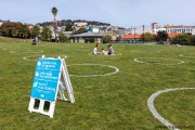 People lay on the grass inside circles drawn to encourage  social distancing at Dolores Park in San Francisco, CA, on  May 21, 2020. This effort marks the city’s latest effort to get back to some sort of normalcy following the long shelter-in-place order while trying to keep the risks of infection from the coronavirus to the minimum.