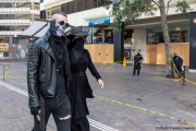 A couple with face masks walks by a local Chase bank with its storefront protected by plywood  in Oakland, CA, on May 30, 2020,